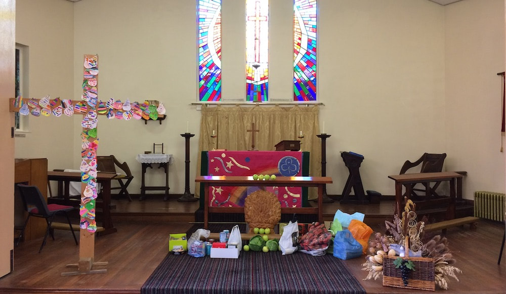 Harvest festival gifts in front of the altar