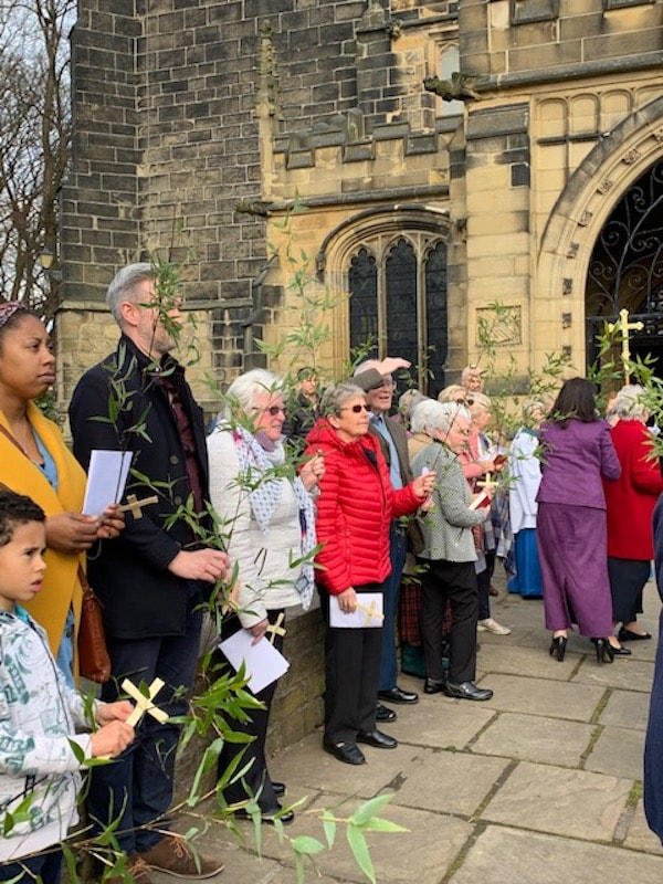 Congregation members outside All Hallows' for Palm Sunday