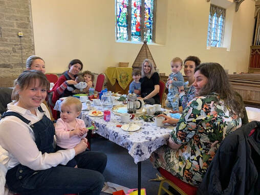 Parents and children at the Tuesday Community cafe at St Lucius'