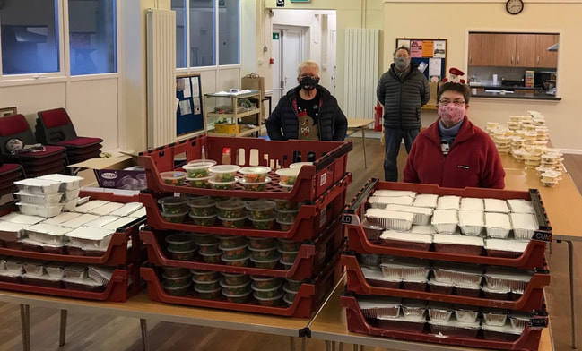 Food Share helpers with ready packed meals